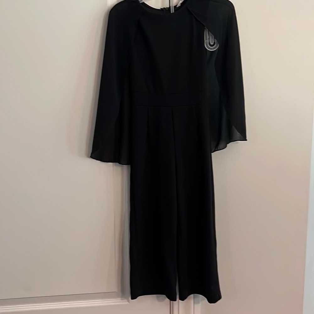 Black jumpsuit with cape sleeves